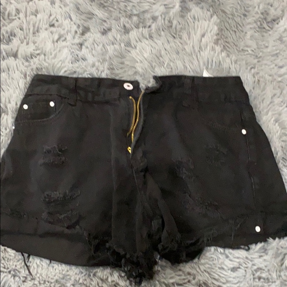 Black ripped shorts